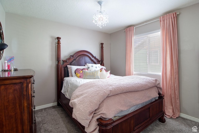 carpeted bedroom featuring a notable chandelier