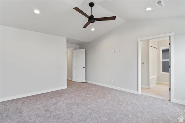 unfurnished bedroom with carpet floors, lofted ceiling, recessed lighting, baseboards, and connected bathroom