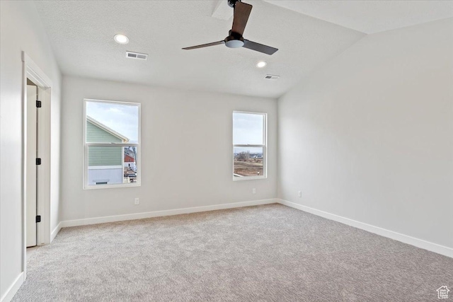 unfurnished room featuring carpet floors, a textured ceiling, a ceiling fan, baseboards, and recessed lighting