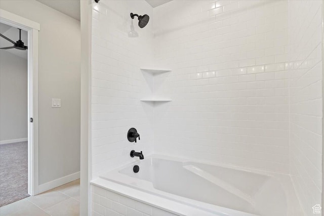 bathroom with baseboards, bathtub / shower combination, and tile patterned flooring