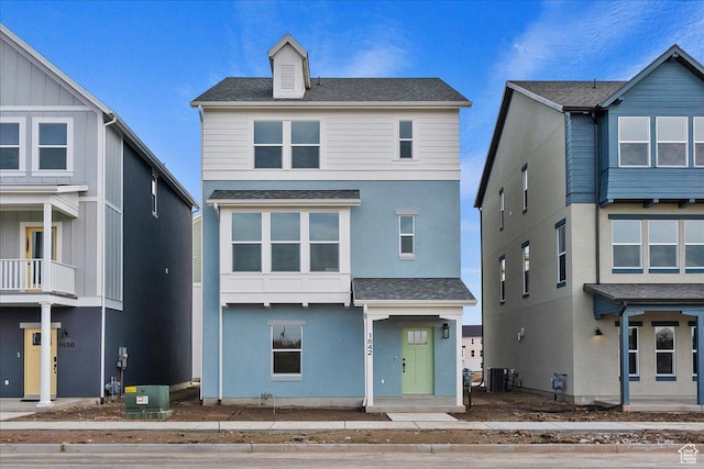view of front of home featuring cooling unit