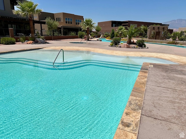 3235 S Retreat Dr, Hurricane, UT 84737 - view of swimming pool featuring a mountain view and a patio area