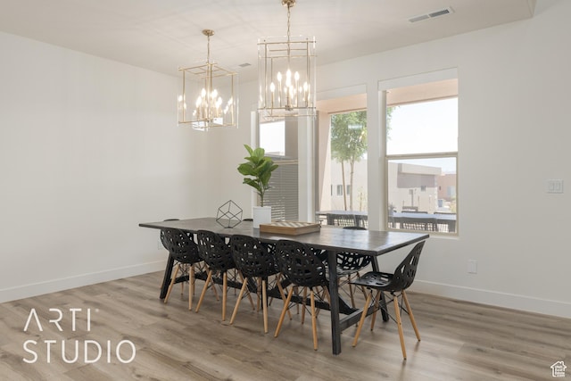 3235 S Retreat Dr, Hurricane, UT 84737 - dining space with light wood-type flooring, a healthy amount of sunlight, and a notable chandelier