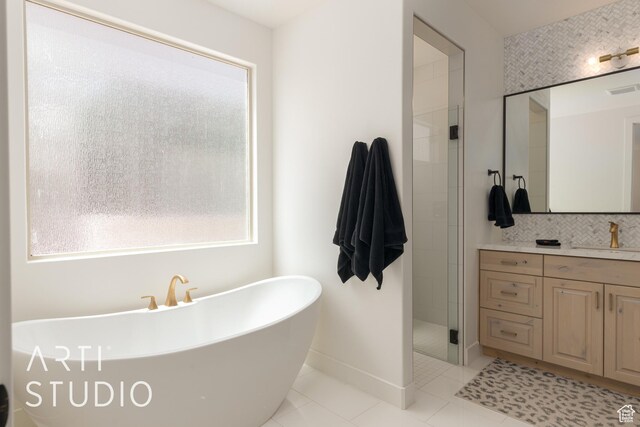 3235 S Retreat Dr, Hurricane, UT 84737 - bathroom featuring tile patterned flooring, vanity, and shower with separate bathtub