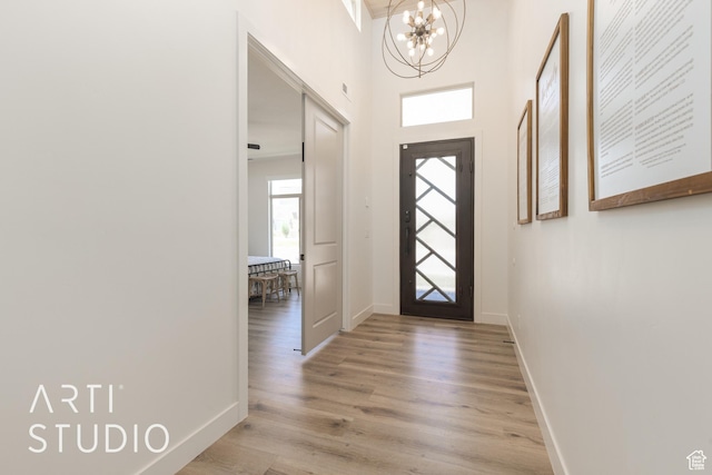 3235 S Retreat Dr, Hurricane, UT 84737 - entrance foyer featuring light hardwood / wood-style flooring and an inviting chandelier