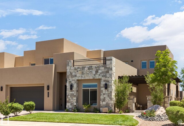 southwest-style home with a garage