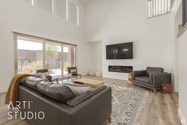 3235 S Retreat Dr, Hurricane, UT 84737 - living room featuring hardwood / wood-style floors and a towering ceiling