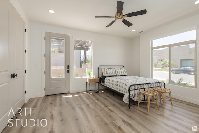 3235 S Retreat Dr, Hurricane, UT 84737 - bedroom featuring ceiling fan, light wood-type flooring, and multiple windows