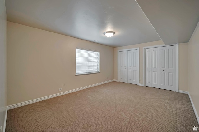 893 N 400 E, Springville, UT 84663 - unfurnished bedroom featuring multiple closets and light carpet