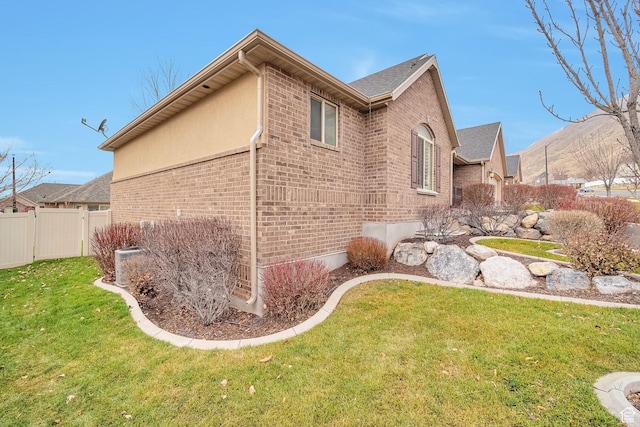 893 N 400 E, Springville, UT 84663 - view of side of home featuring brick siding and roof with shingles