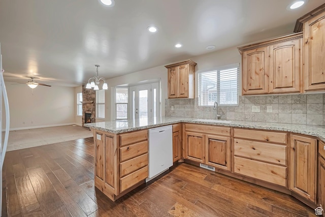 893 N 400 E, Springville, UT 84663 - kitchen with white dishwasher, a peninsula, decorative backsplash, dark wood-style flooring, and open floor plan