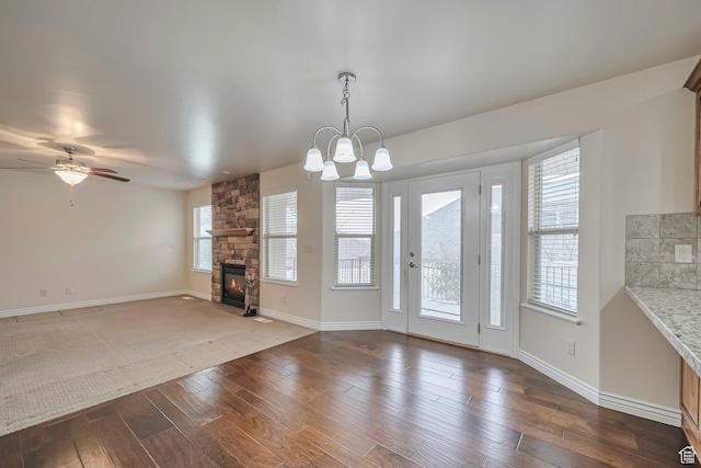 893 N 400 E, Springville, UT 84663 - unfurnished living room featuring a fireplace, dark wood-style flooring, a chandelier, and a ceiling fan