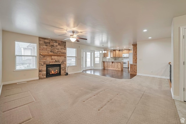 893 N 400 E, Springville, UT 84663 - unfurnished living room with light carpet, ceiling fan, a fireplace, and recessed lighting
