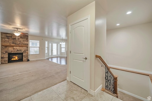 893 N 400 E, Springville, UT 84663 - unfurnished living room featuring a ceiling fan, light colored carpet, a stone fireplace, light tile patterned flooring, and recessed lighting