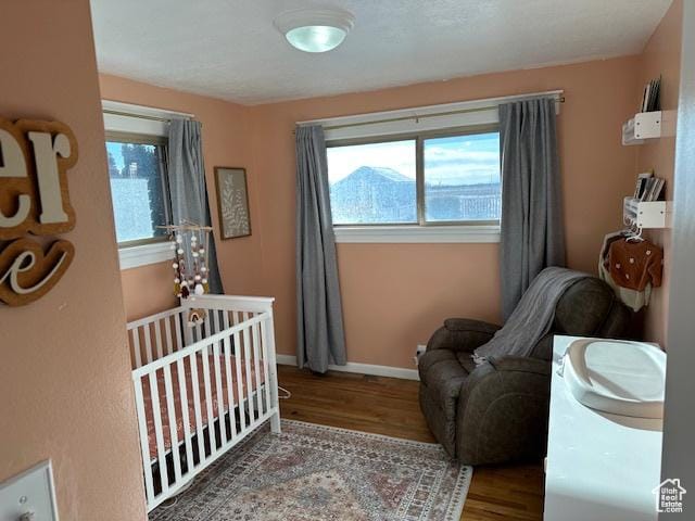 2429 W 300 N, West Point, UT 84015 - bedroom featuring hardwood / wood-style floors and a crib