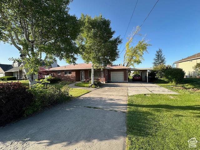 2429 W 300 N, West Point, UT 84015 - ranch-style home with concrete driveway, a front yard, and a garage