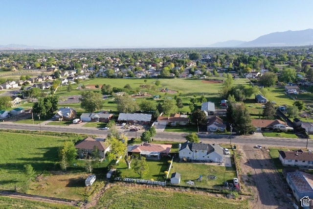 2429 W 300 N, West Point, UT 84015 - aerial overview of property's location with nearby suburban area and a mountain backdrop