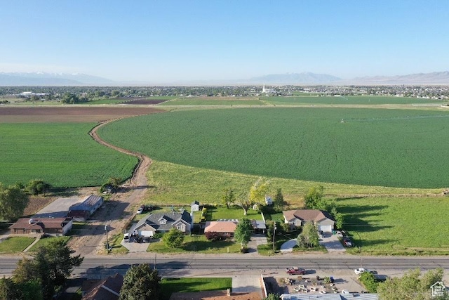 2429 W 300 N, West Point, UT 84015 - aerial view of property and surrounding area featuring rural landscape, large plots for crops, and a mountainous background