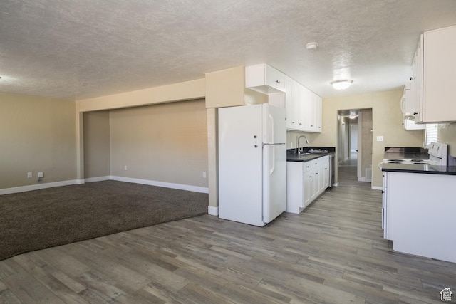kitchen featuring white cabinetry, dark hardwood / wood-style flooring, white appliances, and sink