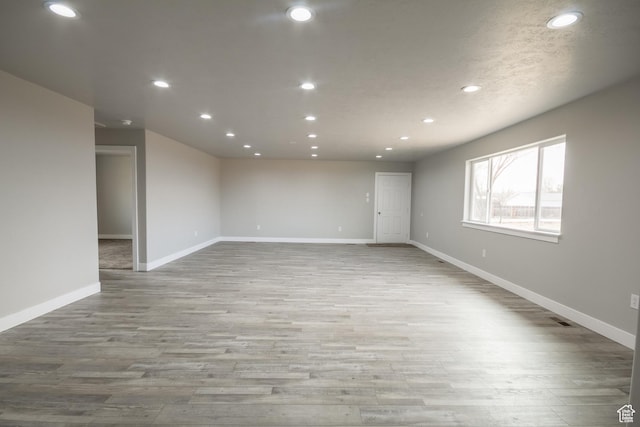 spare room featuring light wood-type flooring