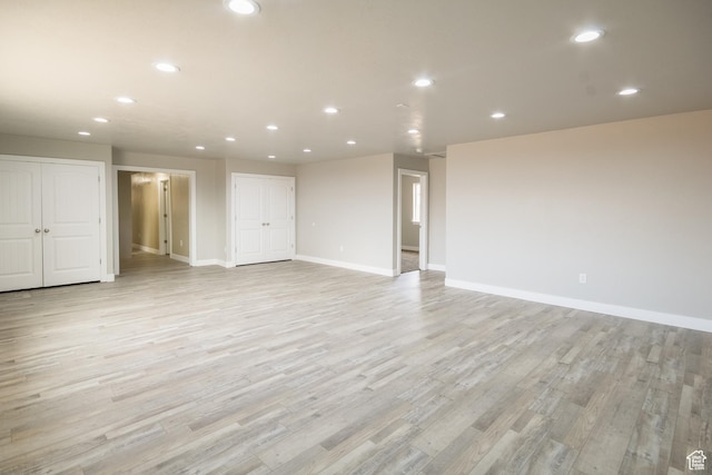 spare room featuring light hardwood / wood-style floors