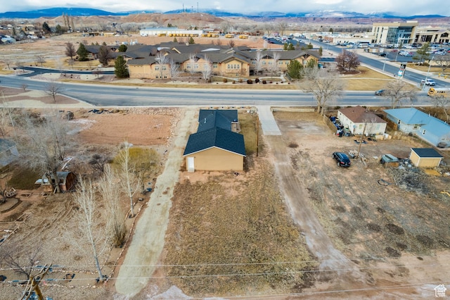 birds eye view of property featuring a mountain view