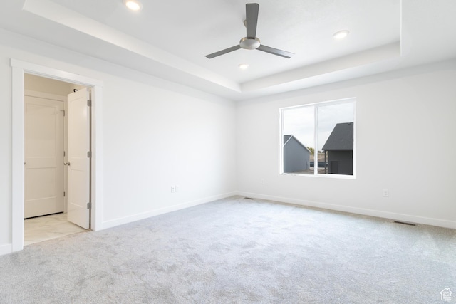 695 S 3550 W Unit 137, West Weber, UT 84401 - unfurnished room featuring a raised ceiling, ceiling fan, and light carpet