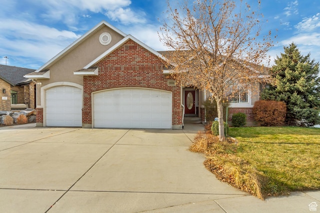 563 W Kalia Cv, Murray, UT 84123 - view of front facade with a front lawn and a garage