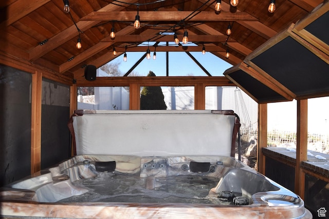 563 W Kalia Cv, Murray, UT 84123 - sunroom with a jacuzzi, vaulted ceiling with beams, and wood ceiling
