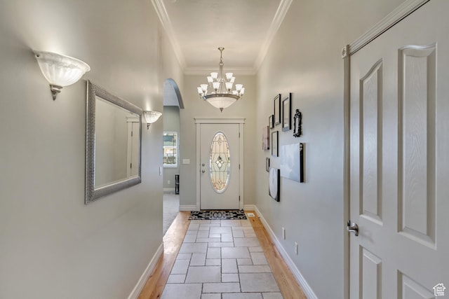 563 W Kalia Cv, Murray, UT 84123 - entryway with a notable chandelier, light tile patterned floors, and crown molding