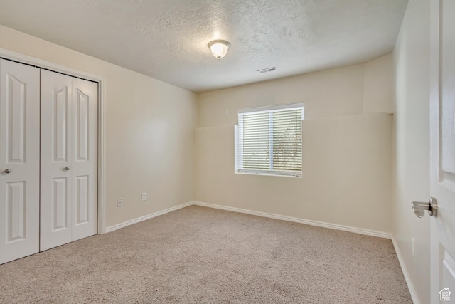 563 W Kalia Cv, Murray, UT 84123 - unfurnished bedroom with a closet, carpet, and a textured ceiling