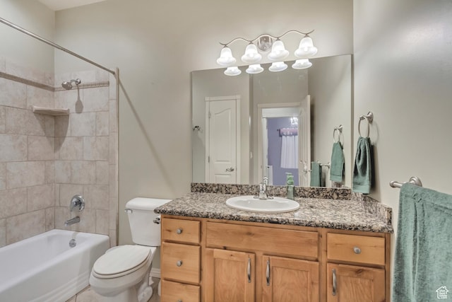 563 W Kalia Cv, Murray, UT 84123 - full bathroom featuring vanity, tiled shower / bath combo, and toilet
