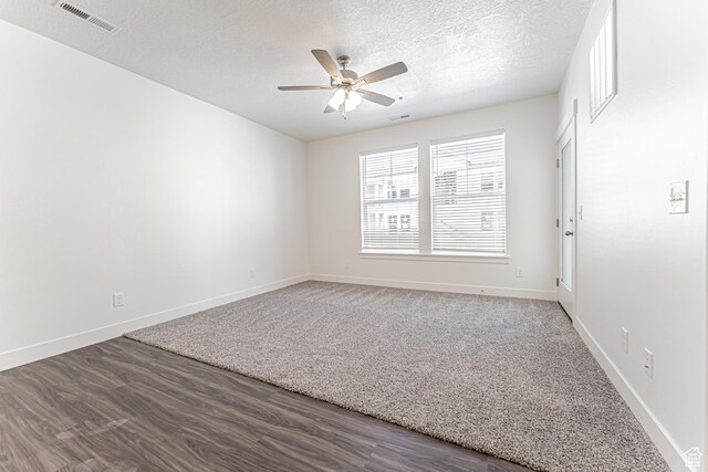 13714 S Hanley Ln Unit Hh204, Riverton, UT 84096 - spare room with a ceiling fan, baseboards, wood finished floors, and a textured ceiling