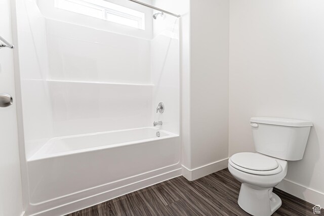 13714 S Hanley Ln Unit Hh204, Riverton, UT 84096 - full bath with baseboards, toilet, shower / tub combination, and wood finished floors
