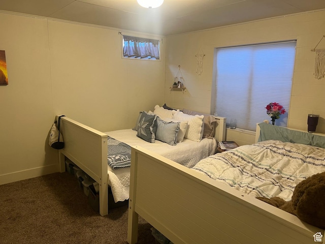 bedroom with dark colored carpet