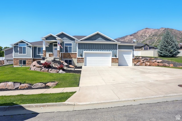 690 W 4125 N, Pleasant View, UT 84414 - craftsman inspired home featuring board and batten siding, an attached garage, stone siding, a front lawn, and concrete driveway