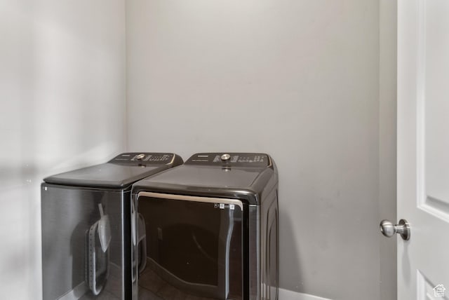 washroom featuring laundry area and washer and clothes dryer