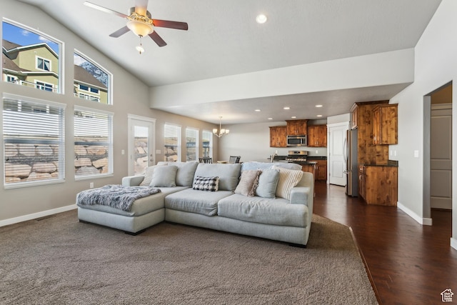 living area with recessed lighting, dark wood-style flooring, baseboards, and ceiling fan with notable chandelier