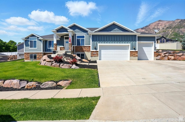690 W 4125 N, Pleasant View, UT 84414 - craftsman house with board and batten siding, stone siding, an attached garage, and concrete driveway