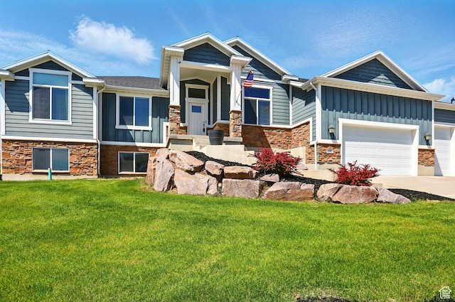 690 W 4125 N, Pleasant View, UT 84414 - view of front of property with stone siding, board and batten siding, a front lawn, driveway, and a garage