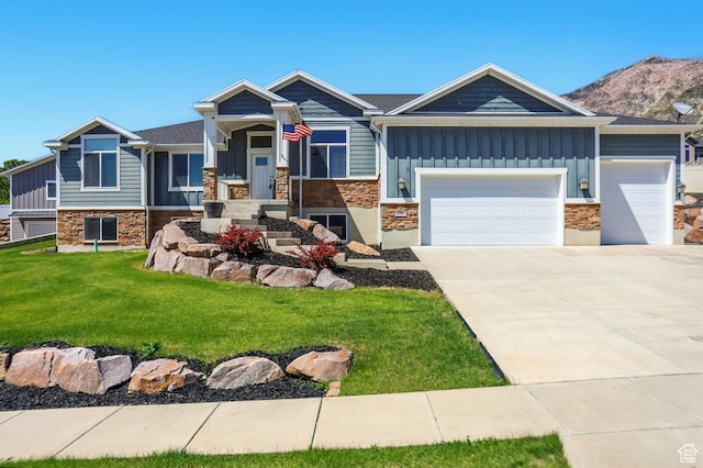 690 W 4125 N, Pleasant View, UT 84414 - craftsman-style house featuring board and batten siding, stone siding, and a front lawn
