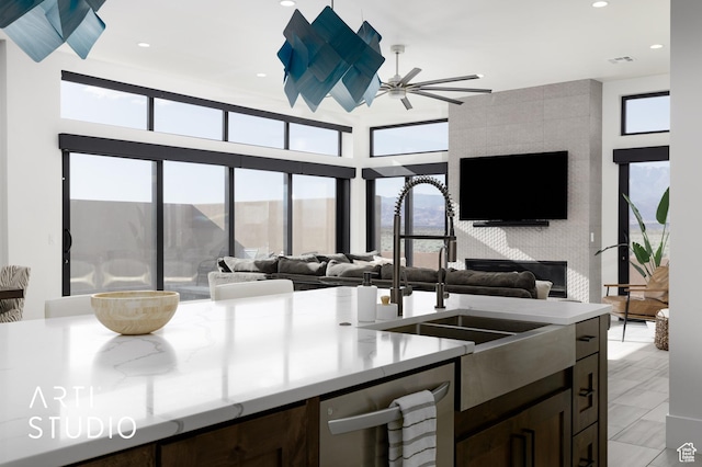 5090 W 3175 S, Hurricane, UT 84737 - kitchen featuring dark brown cabinetry, ceiling fan, dishwasher, and sink