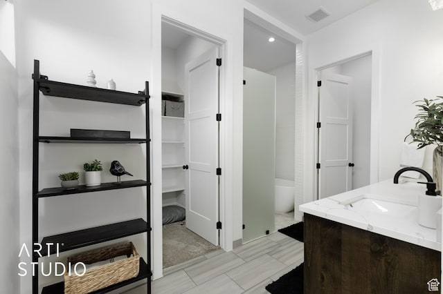 5090 W 3175 S, Hurricane, UT 84737 - bathroom featuring vanity and a tub