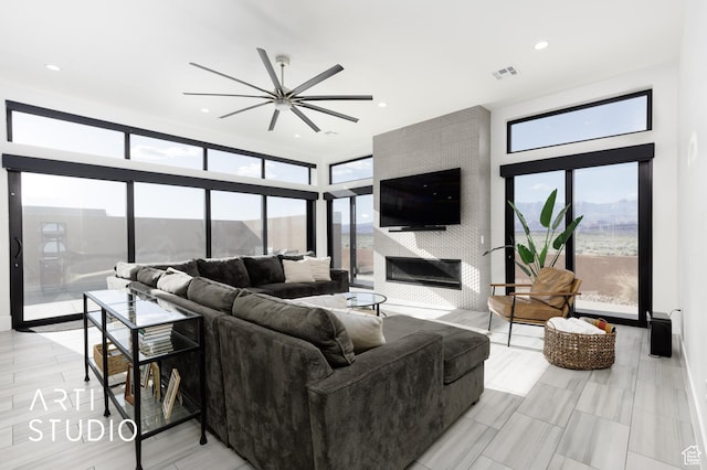 5090 W 3175 S, Hurricane, UT 84737 - living room with ceiling fan and a fireplace