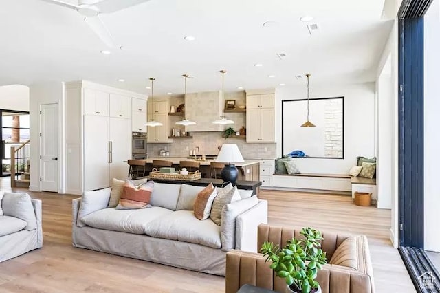 5359 S Pura Cir Unit 142, St George, UT 84790 - living room with light hardwood / wood-style floors and ceiling fan