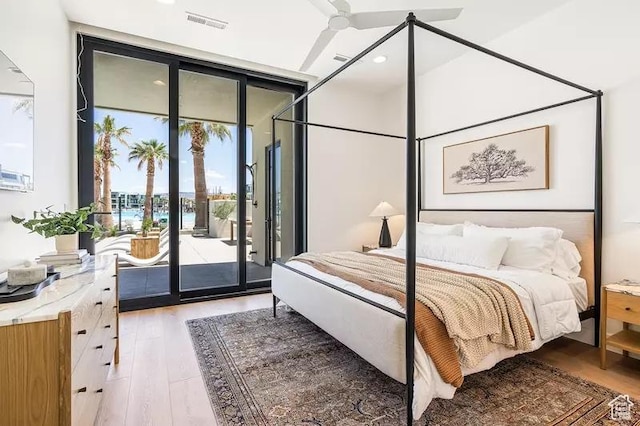 5359 S Pura Cir Unit 142, St George, UT 84790 - bedroom with hardwood / wood-style flooring, ceiling fan, expansive windows, and access to exterior
