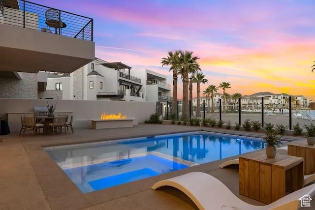 5359 S Pura Cir Unit 142, St George, UT 84790 - pool at dusk with a patio area and an in ground hot tub