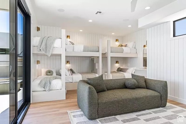 5359 S Pura Cir Unit 142, St George, UT 84790 - bedroom featuring light wood-type flooring and wooden walls