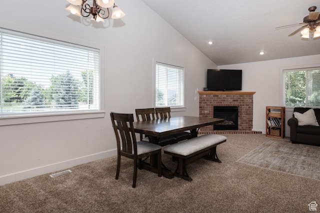 287 S 375 W, Providence, UT 84332 - carpeted dining space featuring ceiling fan with notable chandelier, a fireplace, and vaulted ceiling