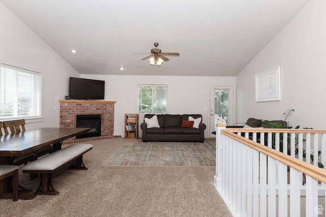 287 S 375 W, Providence, UT 84332 - living room with ceiling fan, a fireplace, light colored carpet, and vaulted ceiling
